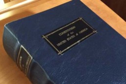 A large book, bound in blue