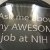 black button with white letters reading, "Ask me about my AWESOME job at NIH"